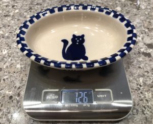 Weight cat food portions with a food scale help with weight loss goals.